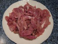 Wash pork and cut it into strips. Peel carrot and...