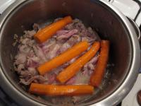 Add meat and carrot to the onion and cook for a...