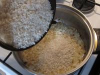 Rinse rice and add it to the onion. Season with...