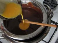 Add beaten egg yolks and boil in a water bath for...