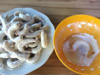 Coat baked crescents with vanilla sugar....