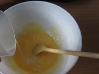 Mix a little water into egg yolks ......