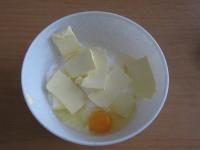 In a bowl place coconut, flour, sugar, chopped...
