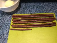 On the board, from the cocoa mass roll up small...