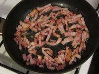 Cut the bacon into the thin strips and fry it....