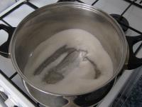 Pour sugar in a deep pot and cook over medium heat...
