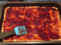 Spread mixed jam over the prebaked dough....