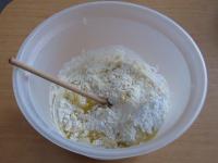 In a bowl pour both kind of flour, add sugar,...