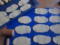Roll out half of balls into thin oval shapes...