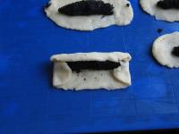 Overlap top edge of dough and bottom edge over the...
