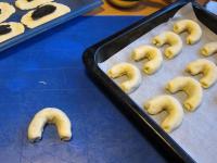 Bend poppy seed crescents into a horseshoe and...
