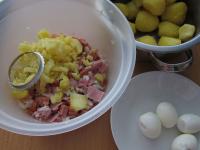 Add potatoes and eggs pressed through the disc...