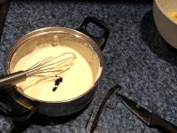 Cut the vanilla bean lengthwise and use a knife to...