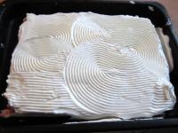 Whisk whipping cream and spread it on top of the...