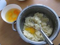 Allow the dough to cool and start adding eggs, one...