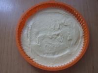 Evenly spread one-half of the dough into silicone...