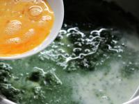 Add eggs and milk to the cold spinach. Season with...
