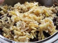 Peel apples, shred them coarsely. Place shredded...