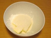 Put in a bowl grated coconut, sugar, and sliced...