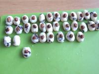 From the white coconut mixture form 34 pieces of...