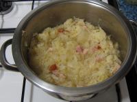 Add squeezed out cabbage, ground black pepper and...