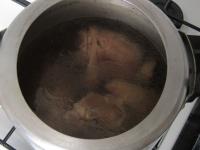 Wash three large front pork knuckles and, if...