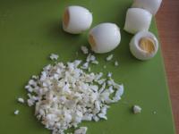 Cut off the edges of eggs and chop them....