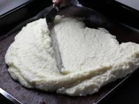 Mix butter with warm cream. Evenly spread the...