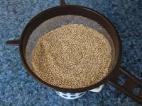 Rinse the quinoa under the running water through...