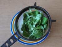 Wash the lamb's lettuce under the running...