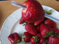 ... and pierce each strawberry from the bottom...