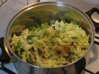 Add it to the onion, salt, add caraway and mix....