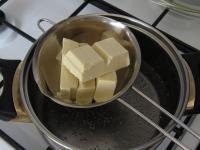 Melt chocolate over a water bath....