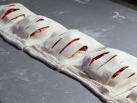 Bend the edges, press them and cut into portions....