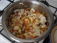 Wash mushrooms, cut them, add to onion with carrot...