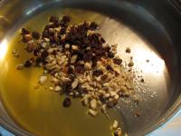 Melt butter in a pan and add almonds, nuts and...
