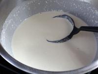 Use a hand whisk and stir whipping cream and milk...