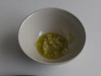 Peel the garlic, press and mix with oil....