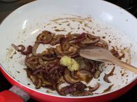Add spices and fry them with onion for a while....