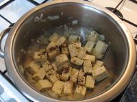 Add tofu to the onion, season and fry for 8...