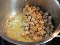 Fry the onion in oil, stirring occasionally. Cut...