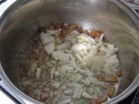 Cut the bacon into strips and fry in a large pot...