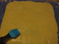 On the floured board, roll out the dough into the...