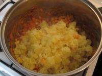 Add the potatoes in the pot and mix everything...