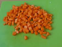 Clean and wash the carrots. Dice them....