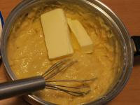 Add butter into the almost cooled pudding ......