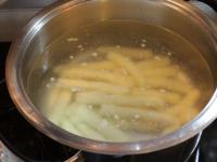 Put the rolls in boiling water and stir the water...