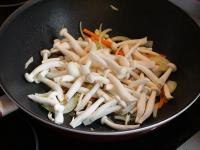 When the onions change the colour, add the...