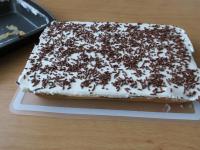 Take the cake out of the baking sheet....