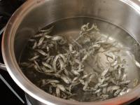 Pour the water with anchovies into a pot and add...
